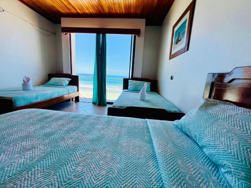 Postel nebo postele na pokoji v ubytování Hotel Sierra Negra