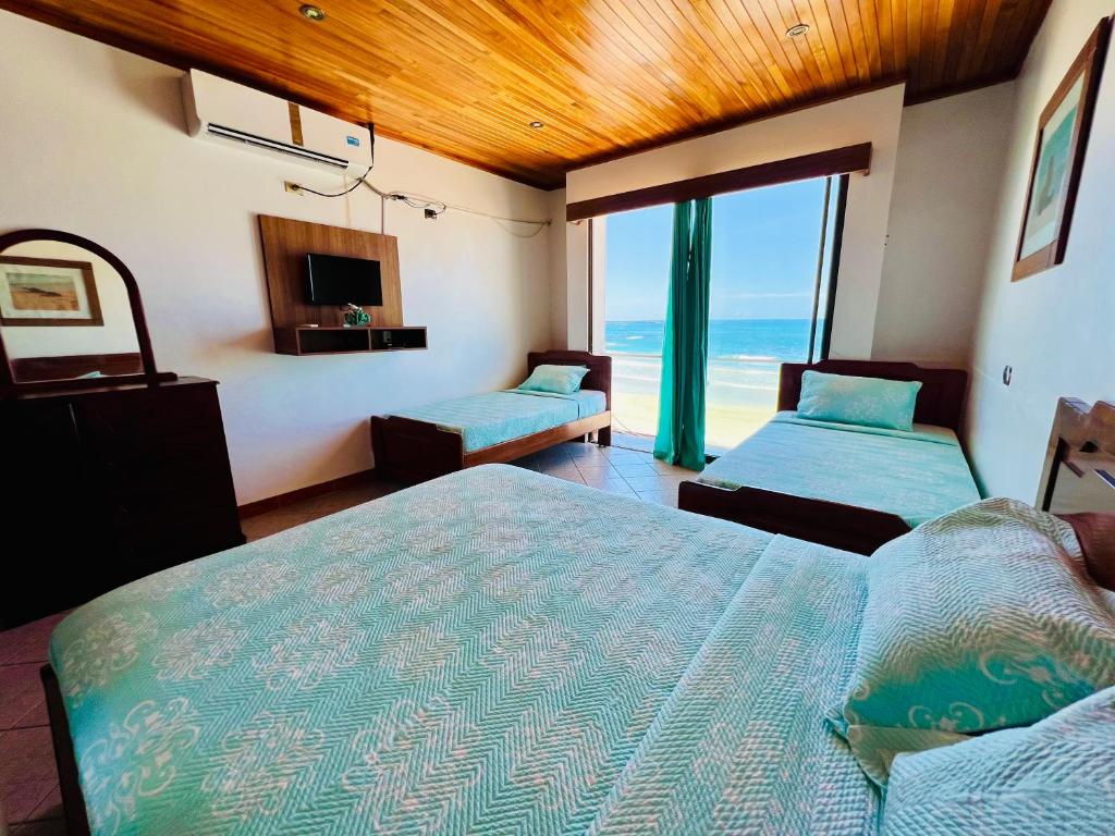 Postel nebo postele na pokoji v ubytování Hotel Sierra Negra