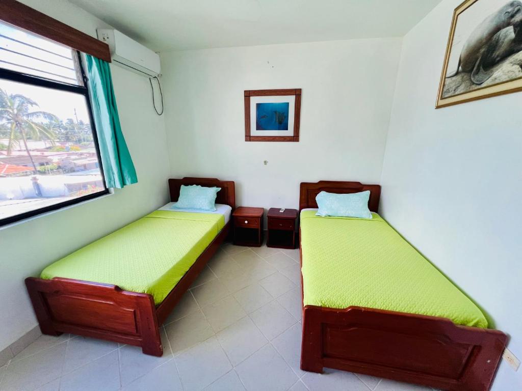 Postel nebo postele na pokoji v ubytování Hotel Sierra Negra