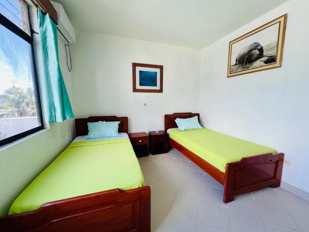 Postel nebo postele na pokoji v ubytování Hotel Sierra Negra