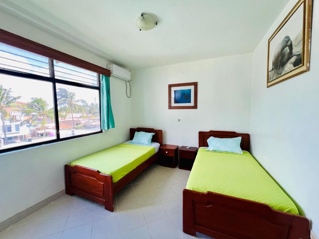 Postel nebo postele na pokoji v ubytování Hotel Sierra Negra