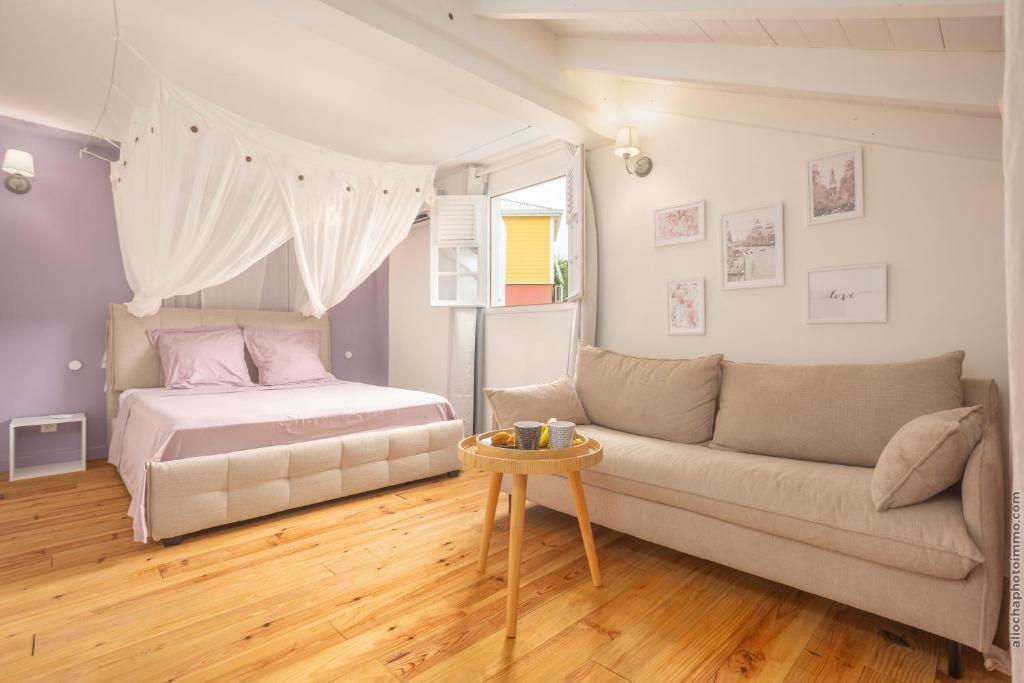 Postel nebo postele na pokoji v ubytování Bungalow Ti Coco