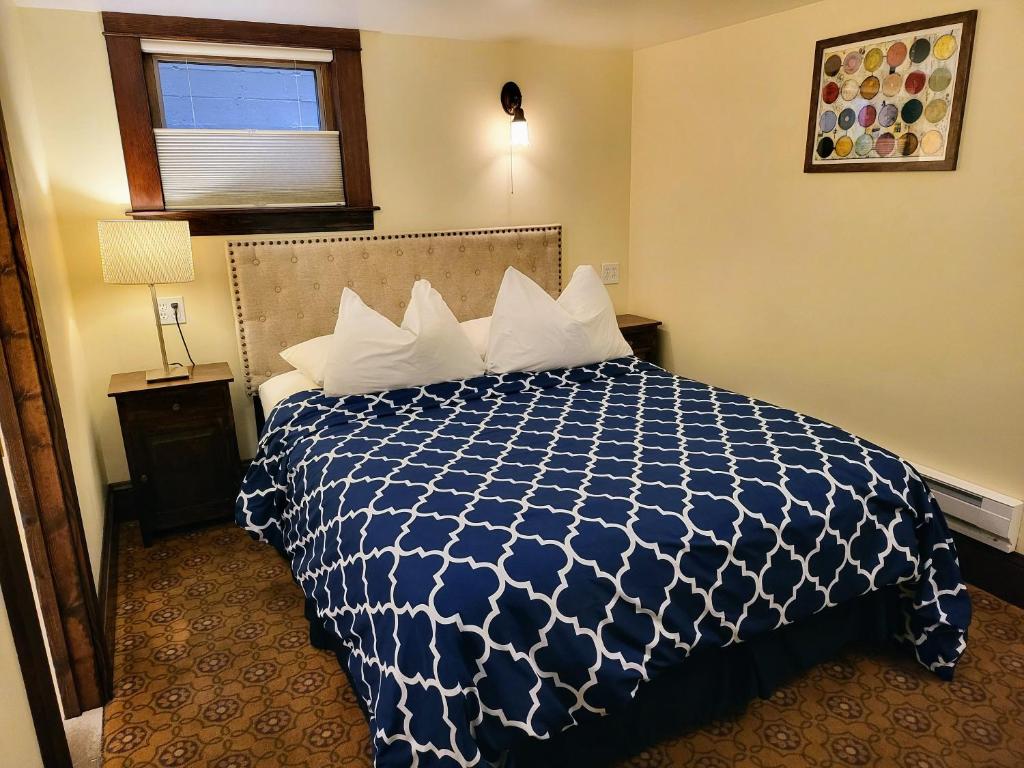 Postel nebo postele na pokoji v ubytování Bluebird Guesthouse
