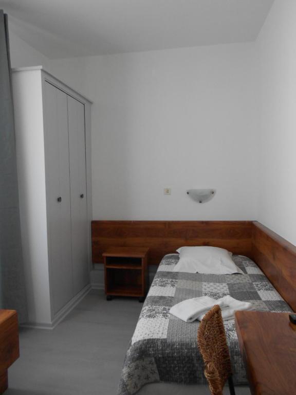 Postel nebo postele na pokoji v ubytování Hotel Du Jura