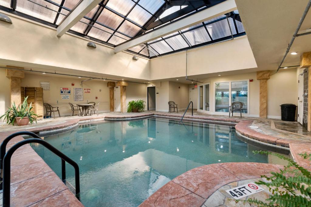 a large indoor pool with an open ceiling at Salty Shenanigans in Kill Devil Hills