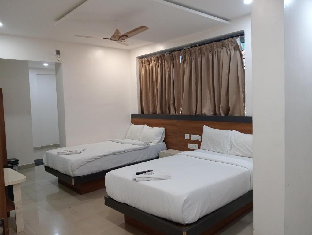 Postel nebo postele na pokoji v ubytování Hotel Stay Prime