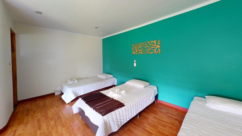 Postel nebo postele na pokoji v ubytování Hotel Villa Colonia