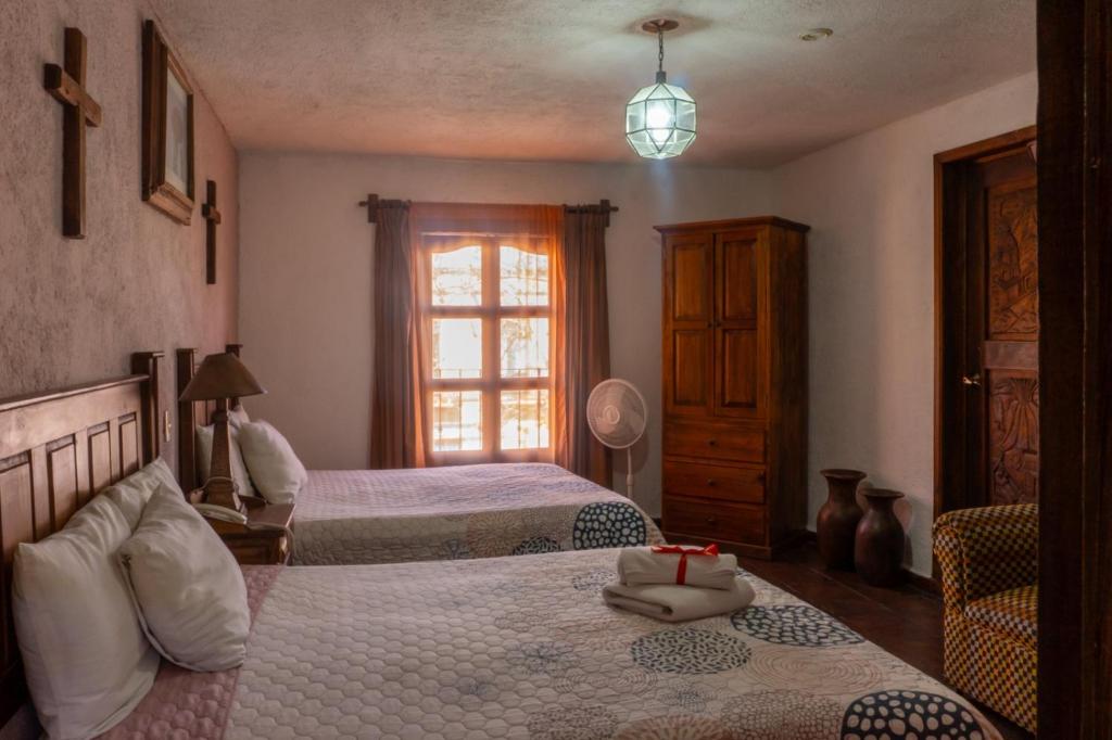 Postel nebo postele na pokoji v ubytování Hotel Refugio Victoria