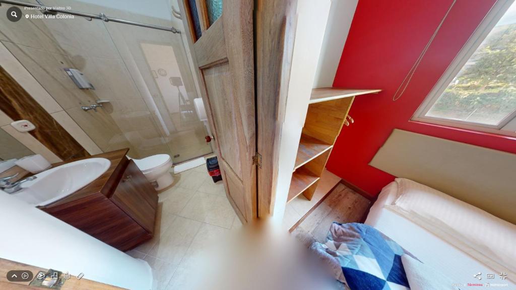 Postel nebo postele na pokoji v ubytování Hotel Villa Colonia