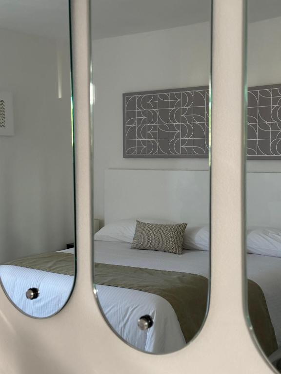 Postel nebo postele na pokoji v ubytování DUNAMIS HOTEL