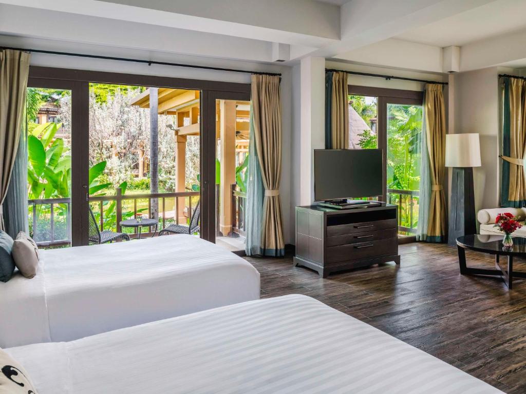 Postel nebo postele na pokoji v ubytování Mövenpick Asara Resort & Spa Hua Hin