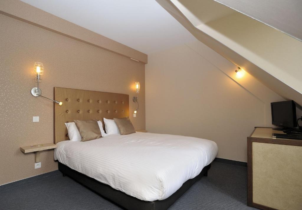 Katil atau katil-katil dalam bilik di Le Relais De La Poste