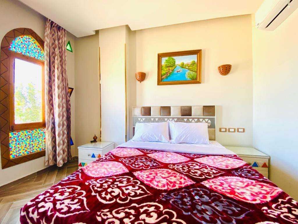 Postel nebo postele na pokoji v ubytování New Abu simbel Hotel & Restaurant