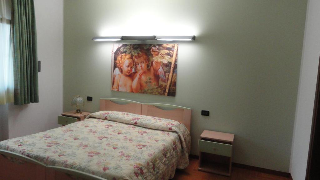Postel nebo postele na pokoji v ubytování Albergo Ristorante Fratte