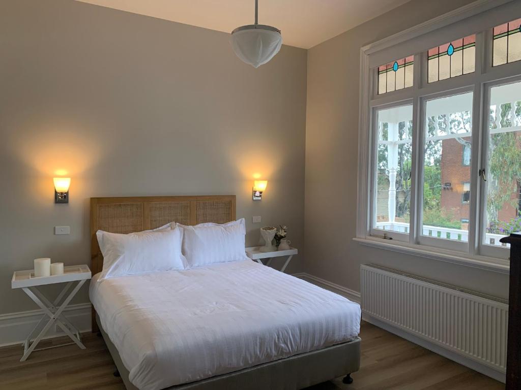 En eller flere senger på et rom på Rodonia - Cottage in Kew