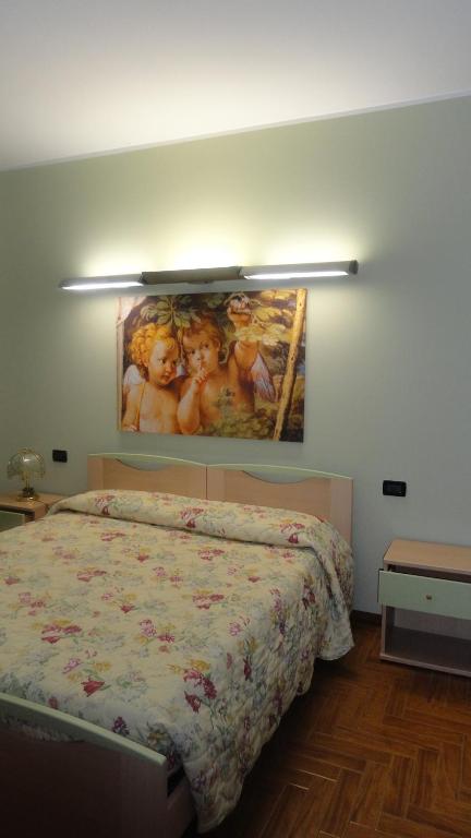 Postel nebo postele na pokoji v ubytování Albergo Ristorante Fratte