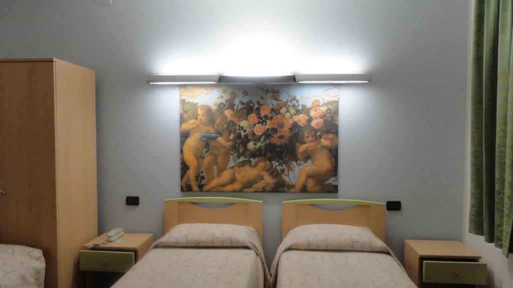 Postel nebo postele na pokoji v ubytování Albergo Ristorante Fratte