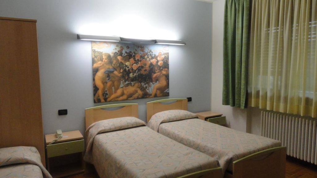 Postel nebo postele na pokoji v ubytování Albergo Ristorante Fratte