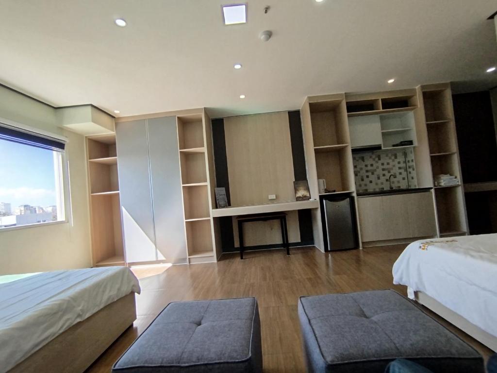 Postel nebo postele na pokoji v ubytování Emmaus condotel