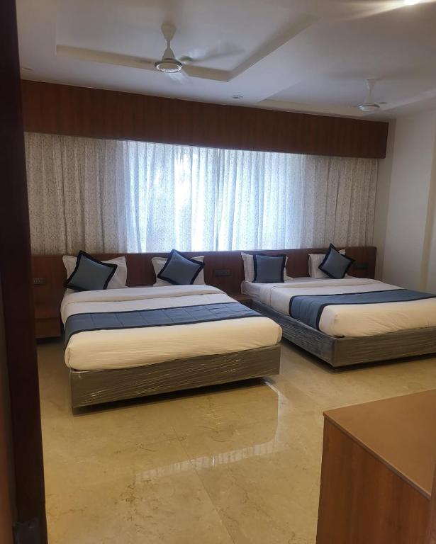 Postel nebo postele na pokoji v ubytování Hotel Sai D-lax