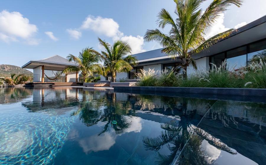 an image of a house with a swimming pool at Luxury Vacation Villa 20 in Pointe Milou