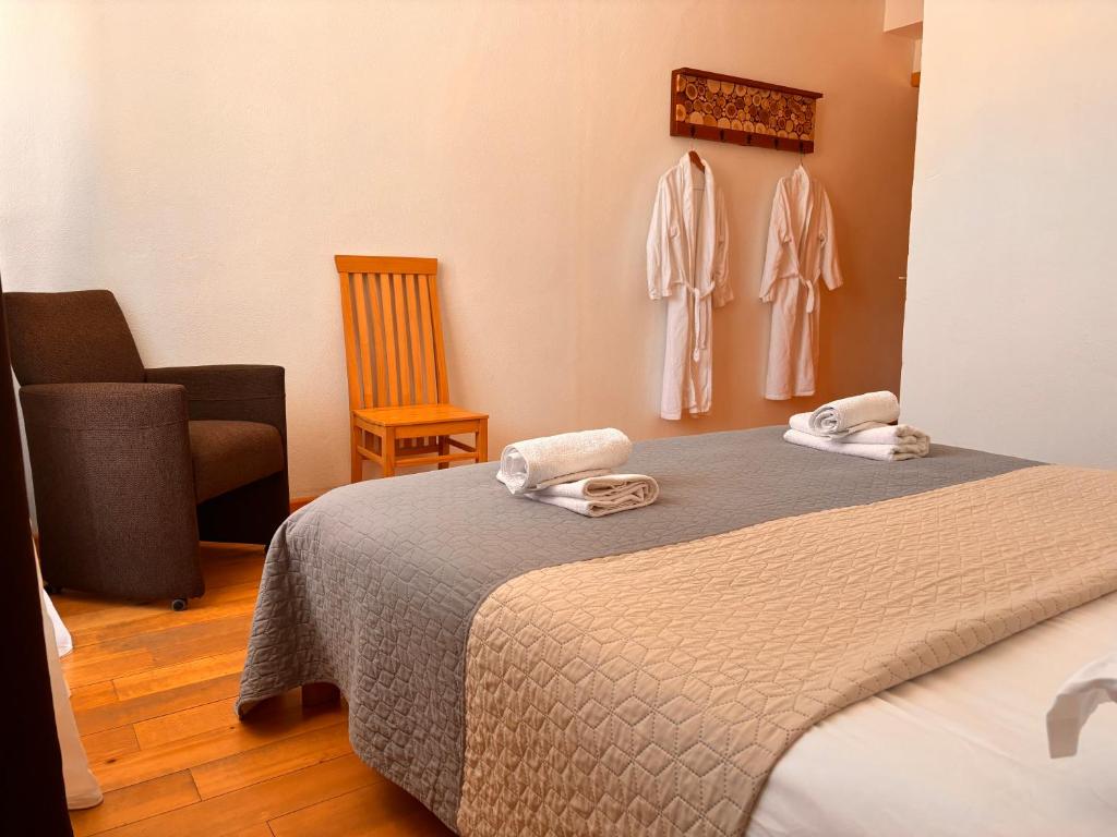 Postel nebo postele na pokoji v ubytování Beko’s garden Inn