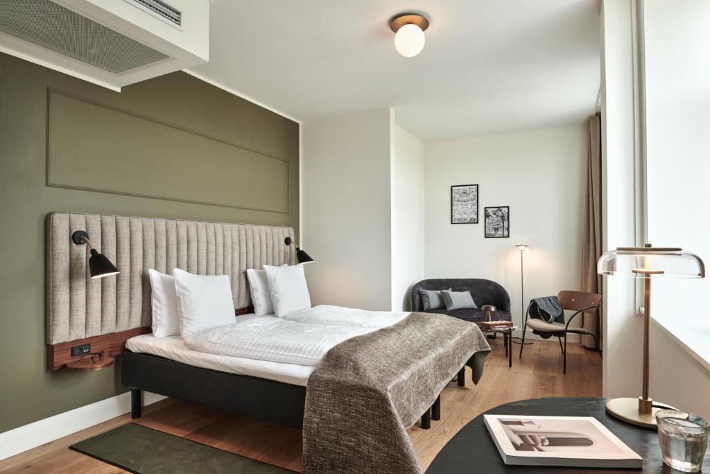 Postel nebo postele na pokoji v ubytování Hotel Sct. Thomas
