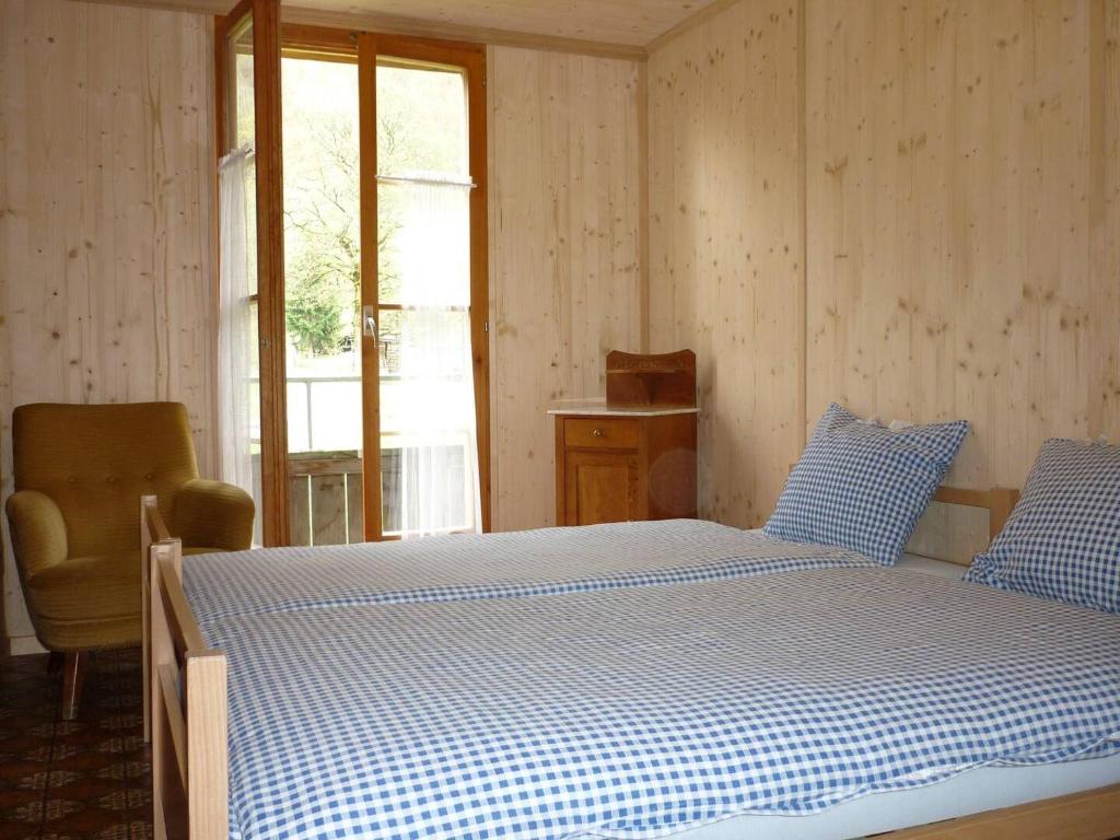 Postel nebo postele na pokoji v ubytování Alpenhof Mountain Lodge