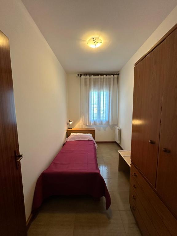 A bed or beds in a room at Residence Beatrice - Agenzia Cocal