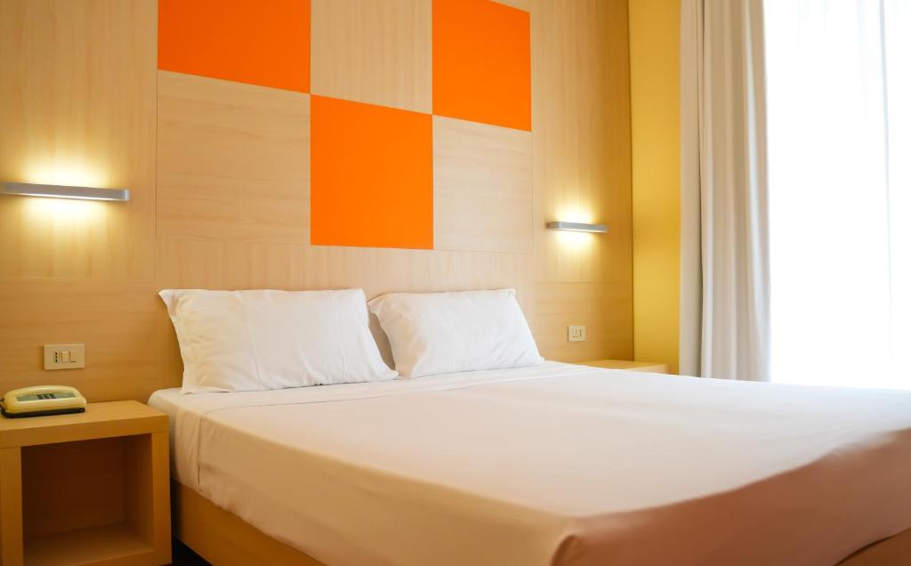 Posteľ alebo postele v izbe v ubytovaní Hotel Regent