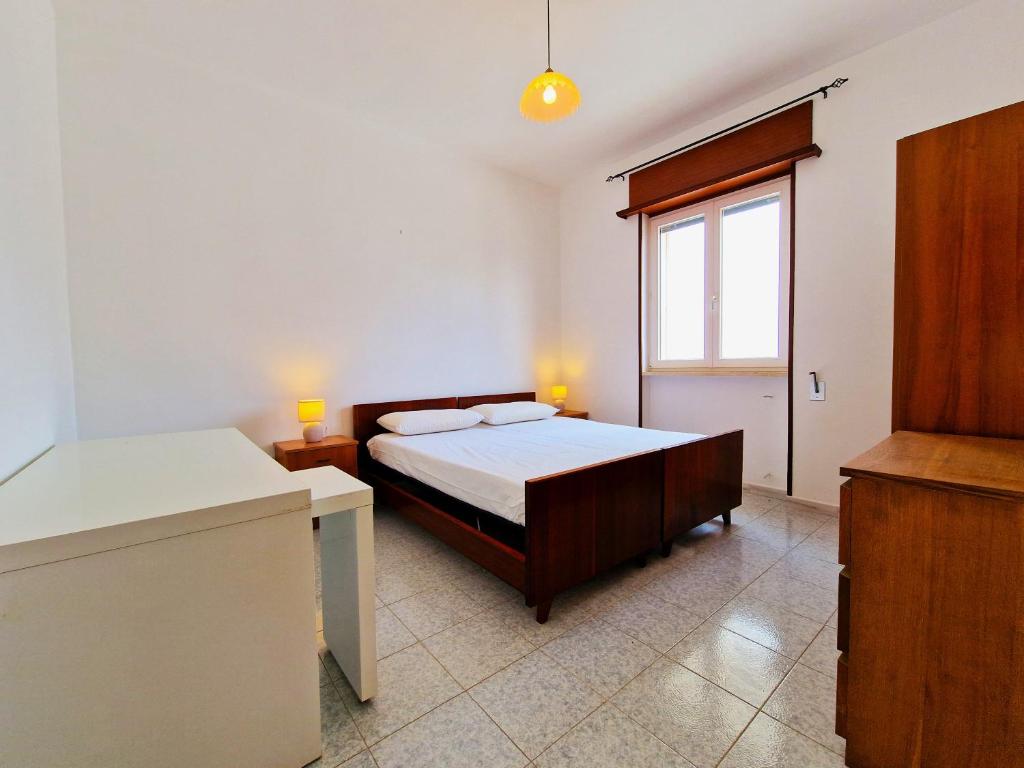 A bed or beds in a room at Casa Vacanza Maria Fronte mare