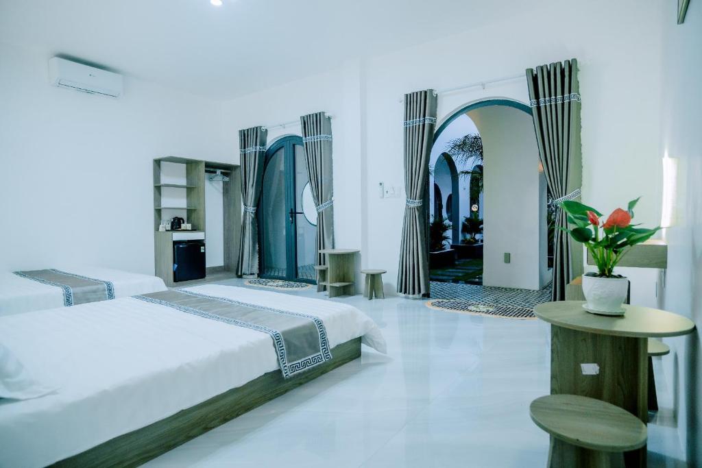 Ένα ή περισσότερα κρεβάτια σε δωμάτιο στο VILLA MINH TRANG - ĐẢO PHÚ QUÝ
