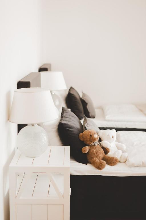 Postel nebo postele na pokoji v ubytování Frost Boutique Hotel
