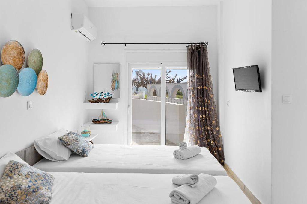 Postel nebo postele na pokoji v ubytování Tommy's Rooms