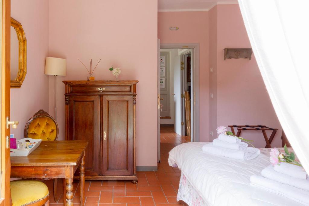 A bed or beds in a room at Rosso Del Chianti