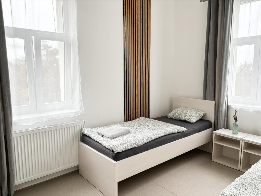 Postel nebo postele na pokoji v ubytování Apartmány Plzeň Zábělá 69