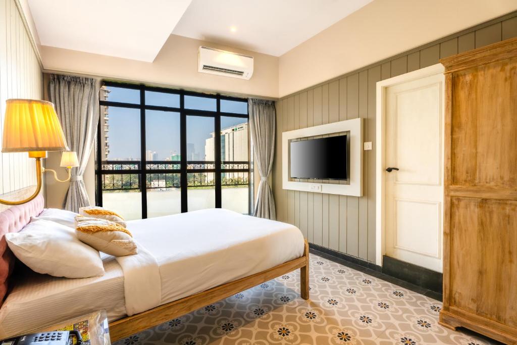 TV a/nebo společenská místnost v ubytování Arnna Hotel - Goregaon