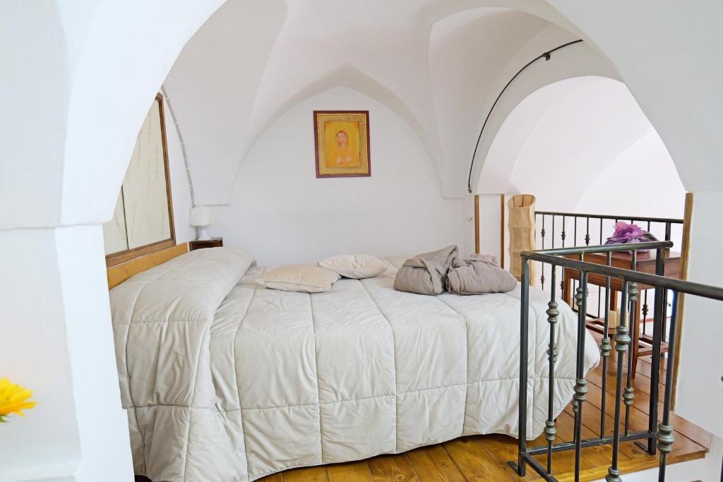 Postel nebo postele na pokoji v ubytování Vicolo dell'Arco