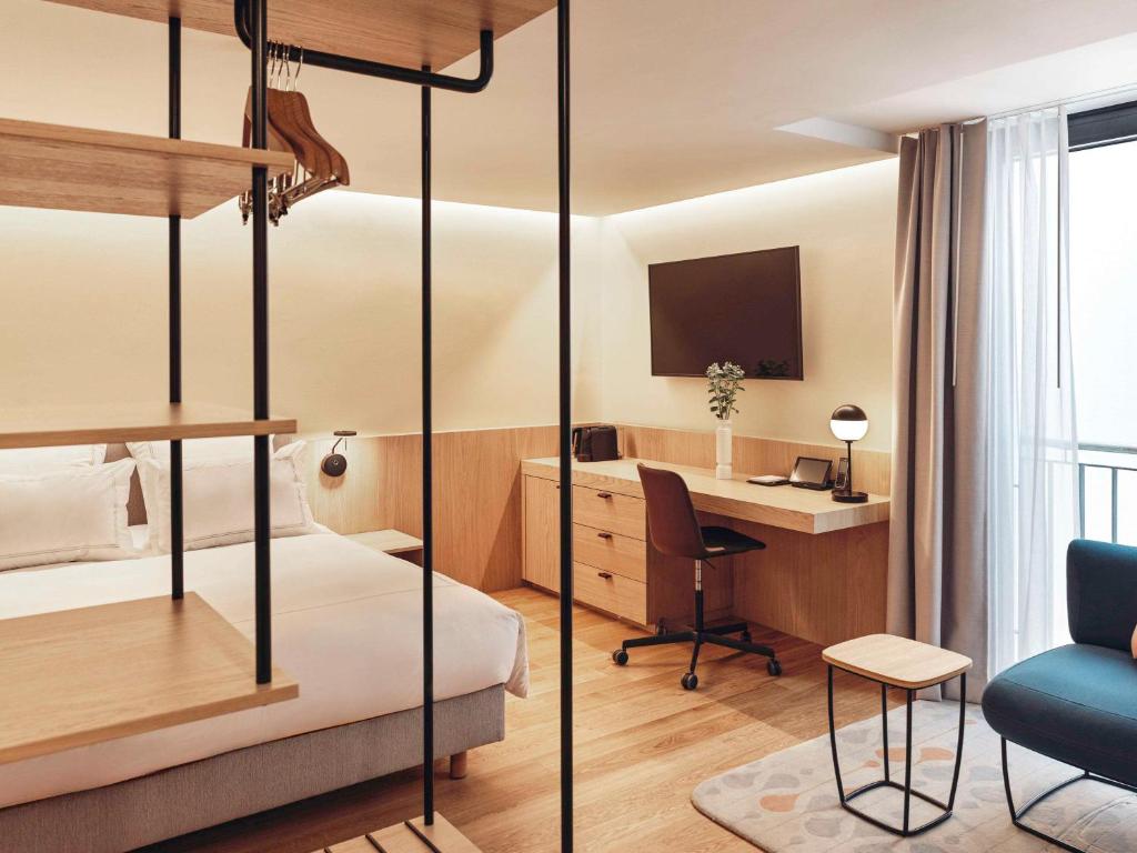 Postel nebo postele na pokoji v ubytování Swissôtel Kursaal Bern