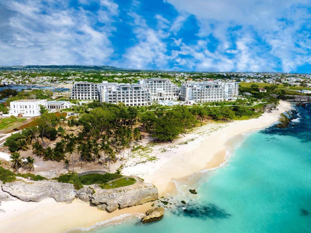 an aerial view of a resort on a beach at Wyndham Grand Barbados Sam Lords Castle All Inclusive Resort in Saint Philip