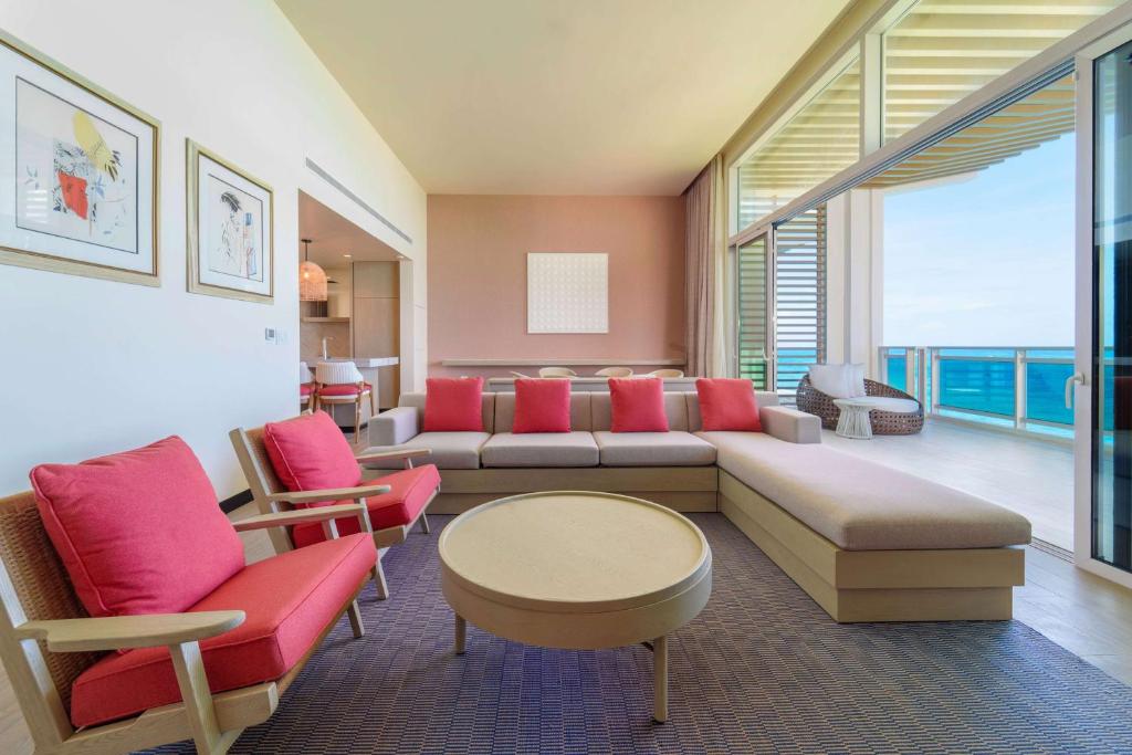 a living room with a couch and chairs and a table at Wyndham Grand Barbados Sam Lords Castle All Inclusive Resort in Saint Philip