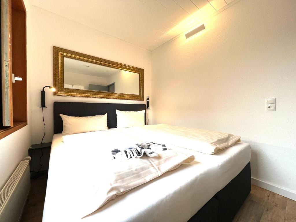 Postel nebo postele na pokoji v ubytování Pension Haus Lassen