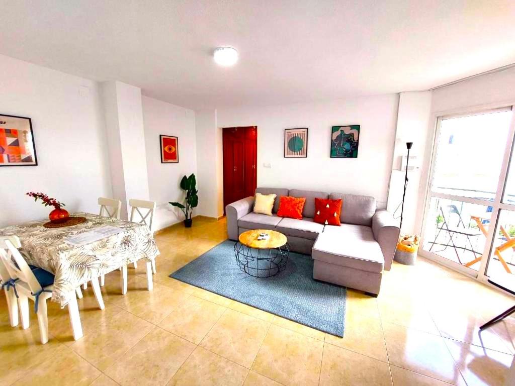 a living room with a couch and a table at Paraná Center Apartment in Seville