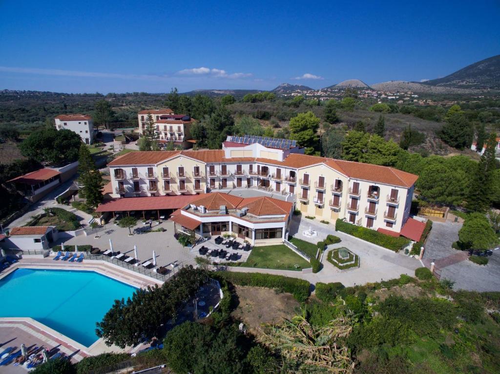 an aerial view of a hotel with a pool at Karavados Beach Hotel in Karavadhos