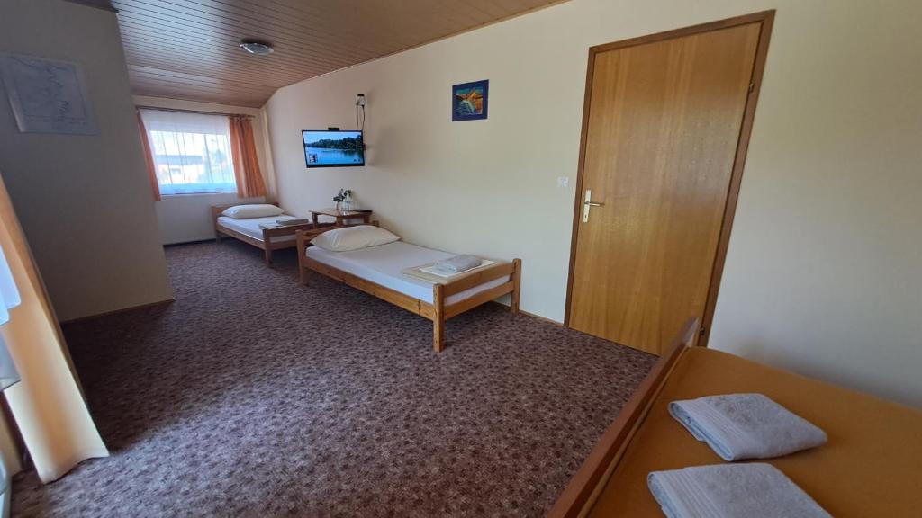 Postel nebo postele na pokoji v ubytování Family Puškarić