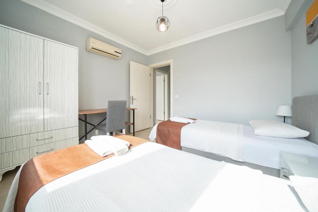 Postel nebo postele na pokoji v ubytování MASAL APART HOTEL