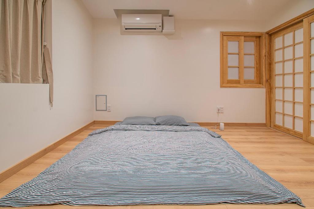 Giường trong phòng chung tại Hajime Homestay Hue