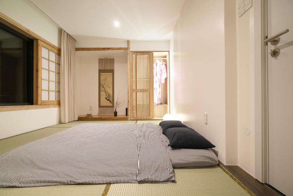 Postel nebo postele na pokoji v ubytování Hajime Homestay Hue