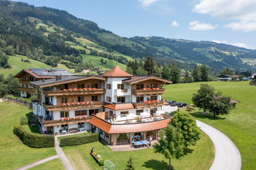 an aerial view of a large house in the mountains at Appartements Haflingerhof in Westendorf