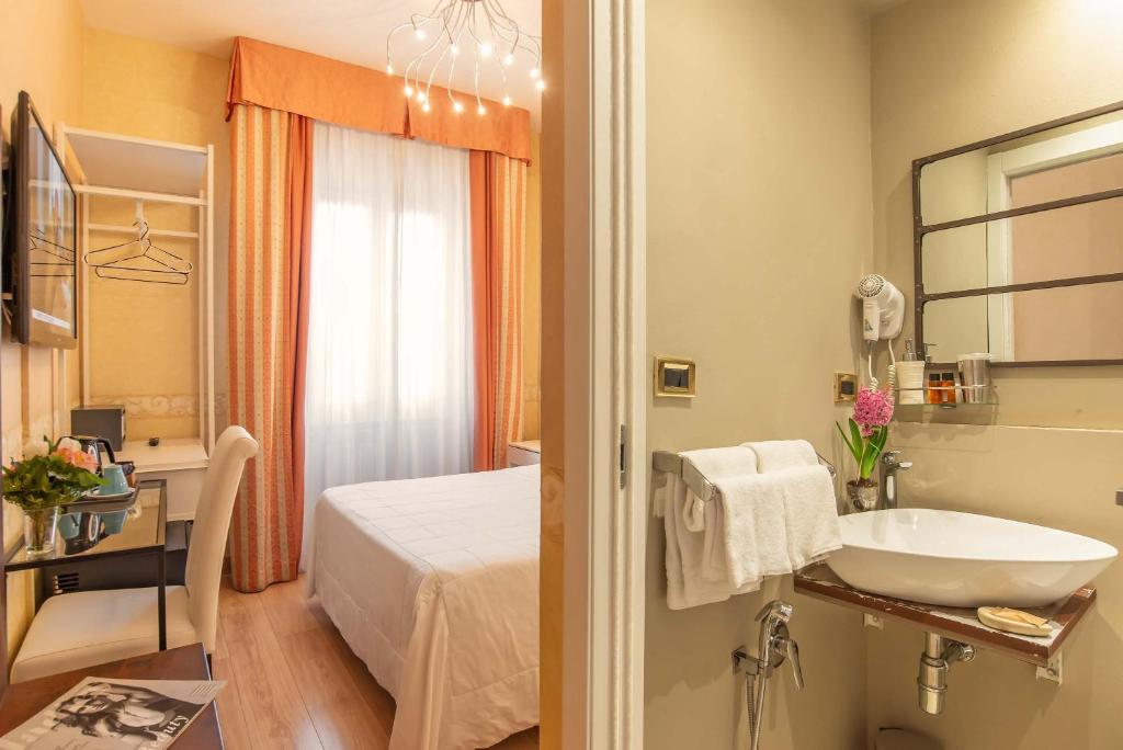 Postel nebo postele na pokoji v ubytování Hotel Jane